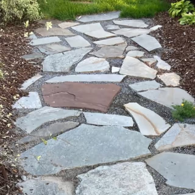 Flagstone path installation shared by Thunder Landscape